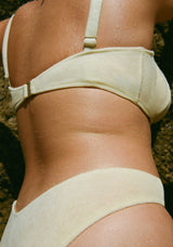 close_up_of_woman_wearing_selina_towelling_cream_bikini