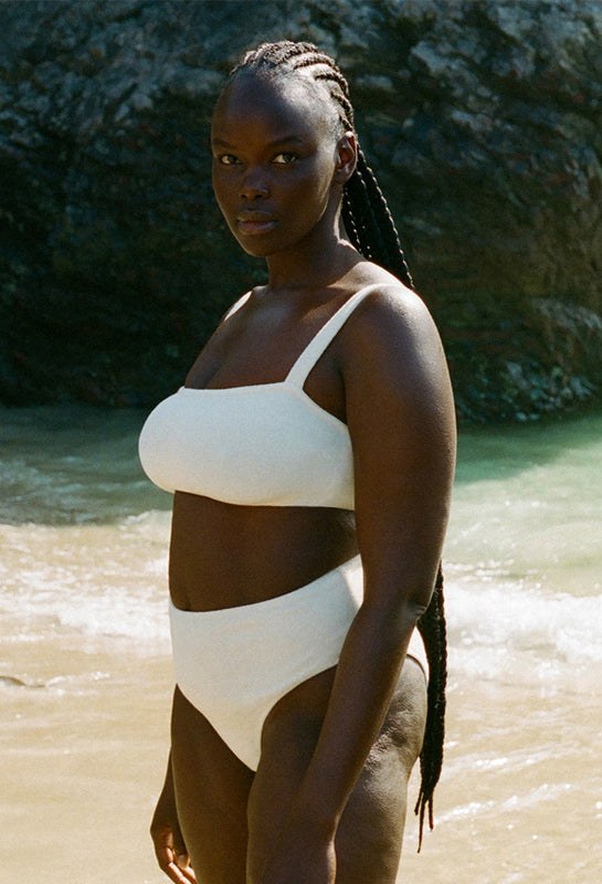 women_on_beach_wearing_towelling_cream_bikini_set