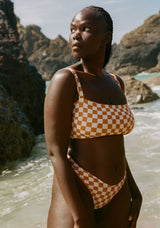 women_on_beach_wearing_lucy_checker_bikini_bottoms